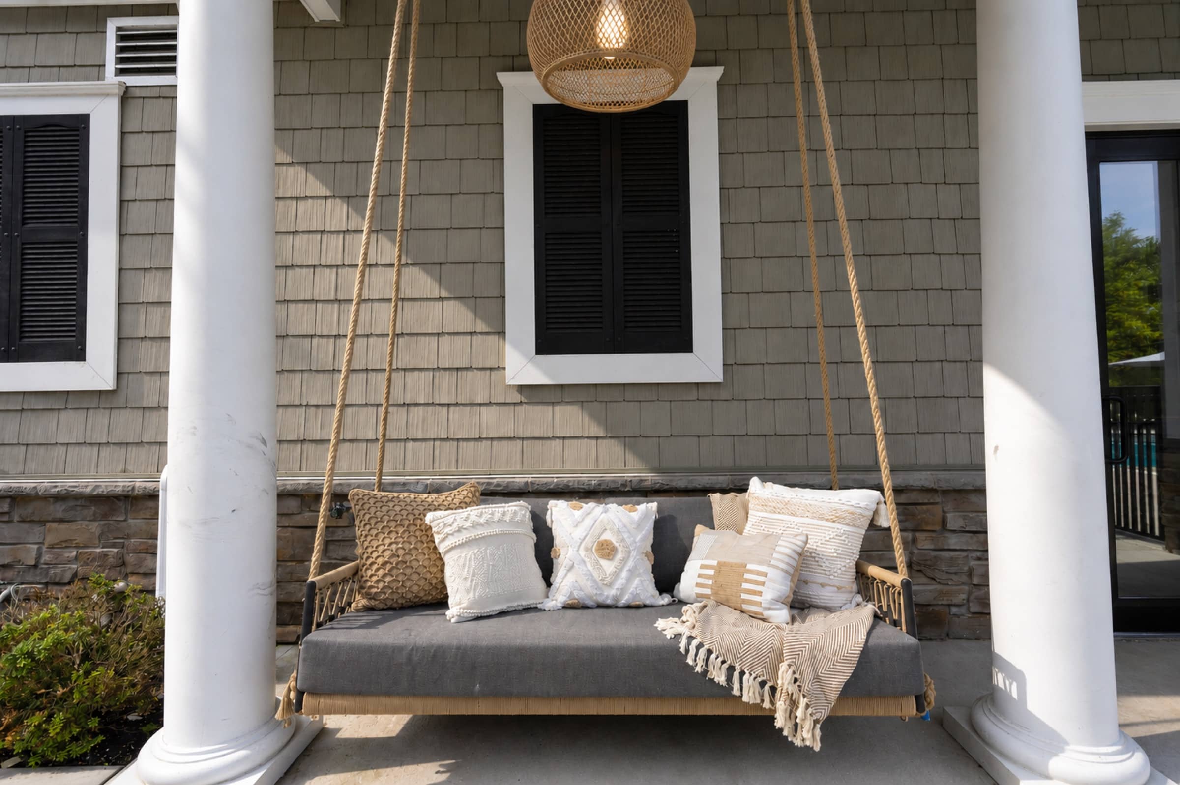 Porch swing at White Oaks — life in Wilton, Connecticut
