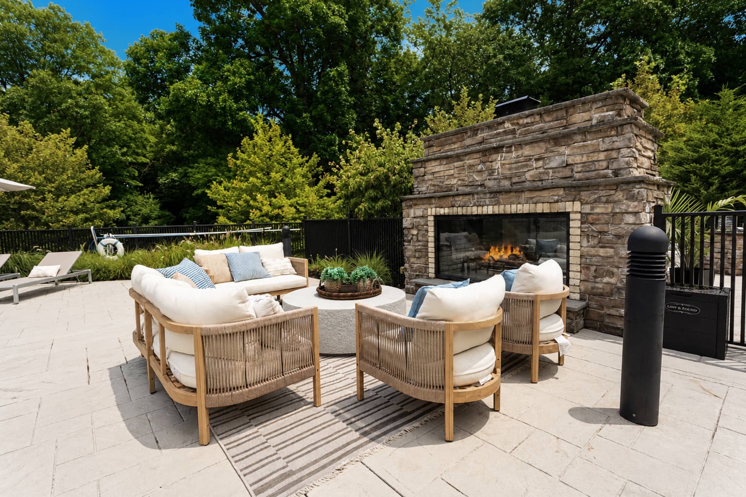 Fireside lounge chairs by the outdoor fireplace at White Oaks
