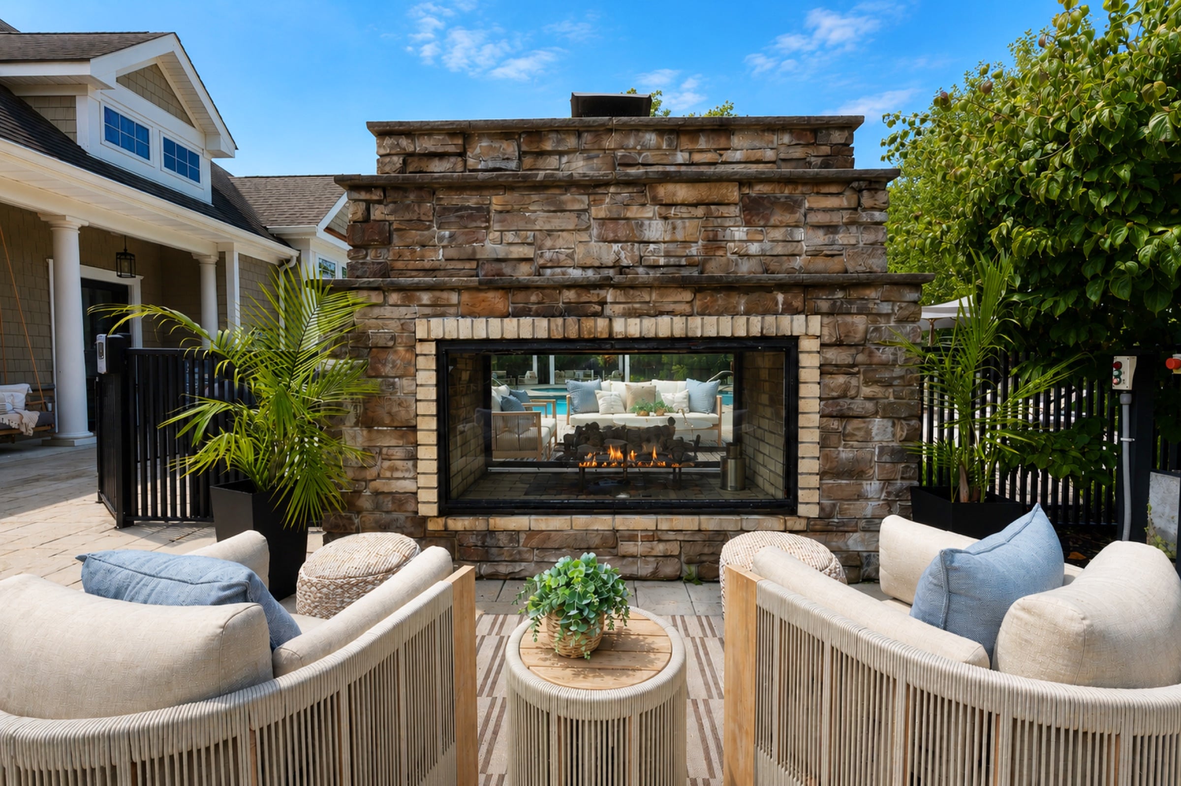 Outdoor stone fireplace lounge at White Oaks