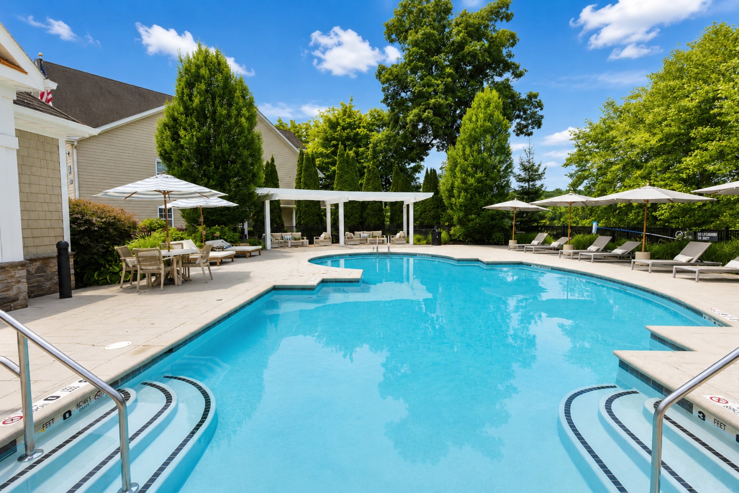 Heated pool and sundeck at White Oaks on a summer day