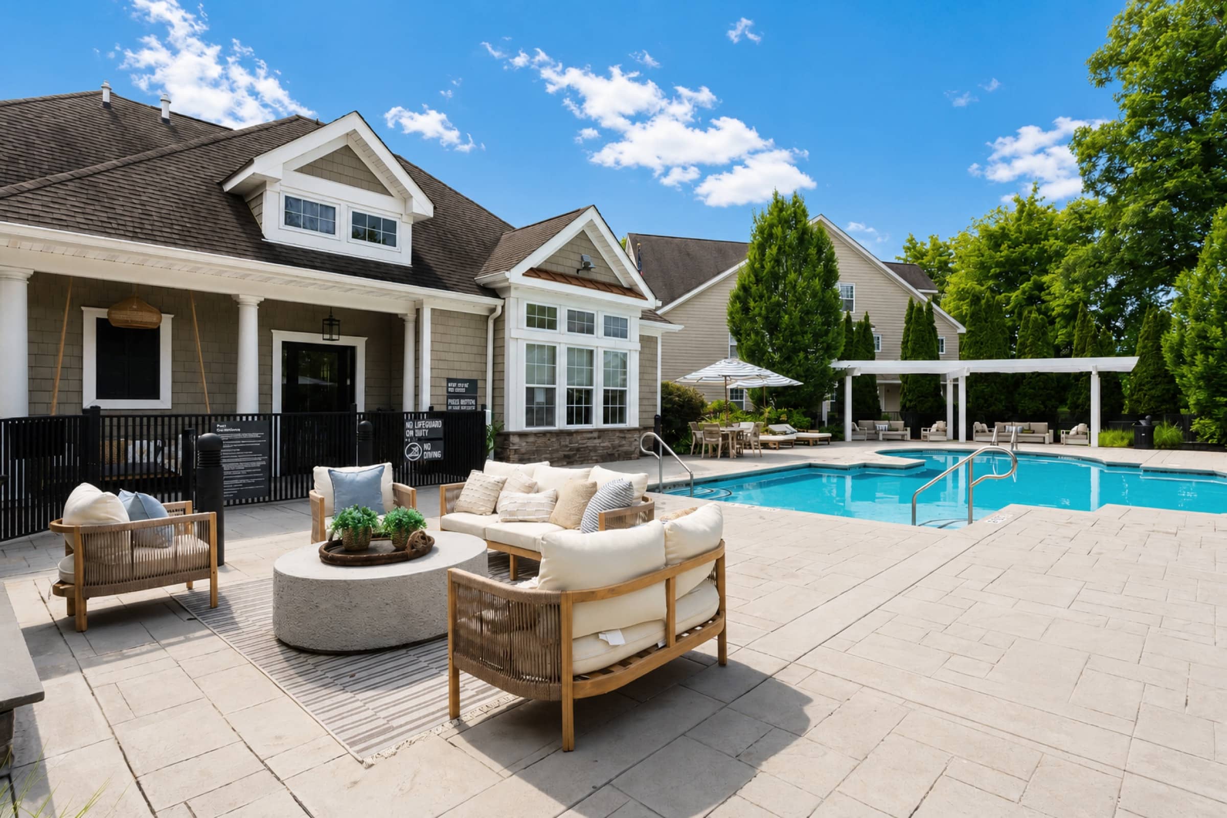 White Oaks homes beyond the pool — minutes from Wilton's Metro-North station